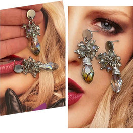 Aros Hippie Chic de acero inoxidable plateado y  cristales en racimo en tonos grises.